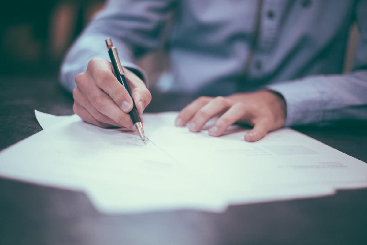 Bookkeeper reviewing invoices and reconciling accounts